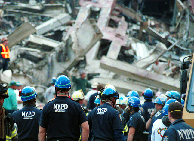 Police officers and other emergency workers are seen at the World Trade Center site - New York, NY - Sep 13, 2001 - Photo: Chris Hondros/Getty Images