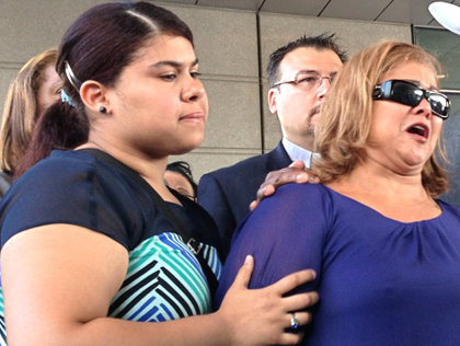 The family of a 10-year-old girl allegedly raped by her Bronx teacher hold a press conference on June 24, 2013 (credit: Alex Silverman/WCBS 880)