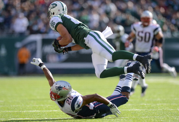 EAST RUTHERFORD, NJ - OCTOBER 20: Wide receiver David Nelson #86 of the New York Jets makes a diving catch over defensive back Marquice Cole #23 of the New England Patriots in the 3rd quarter of the New York Jets 30-27 win over the New England Patriots at MetLife Stadium on October 20, 2013 in East Rutherford, New Jersey. (Photo by Ron Antonelli/Getty Images)