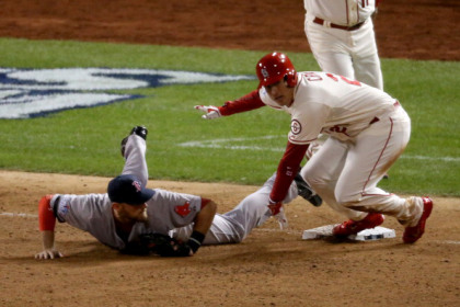ST LOUIS, MO - OCTOBER 26:  Allen Craig #21 of the St. Louis Cardinals gets tripped up by Will Middlebrooks #16 of the Boston Red Sox during the ninth inning of Game Three of the 2013 World Series at Busch Stadium on October 26, 2013 in St Louis, Missouri.  