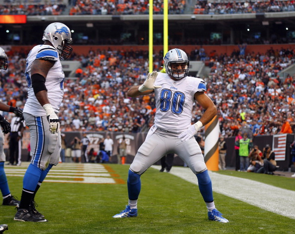 LEVELAND, OH - OCTOBER 13:  Tight end Joseph Fauria #80 of the Detroit Lions celebrates after scoring a touchdown with tackle Corey Hilliard #78 against the Cleveland Browns at FirstEnergy Stadium on October 13, 2013 in Cleveland, Ohio.  (Photo by Matt Sullivan/Getty Images)