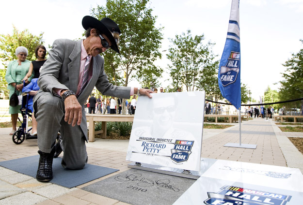 CHARLOTTE, NC - MAY 20: Richard Petty revels a granite tile bearing his signature and induction year during the Walk of Fame unveiling at the NASCAR Hall of Fame on May 20, 2010 in Charlotte, North Carolina.