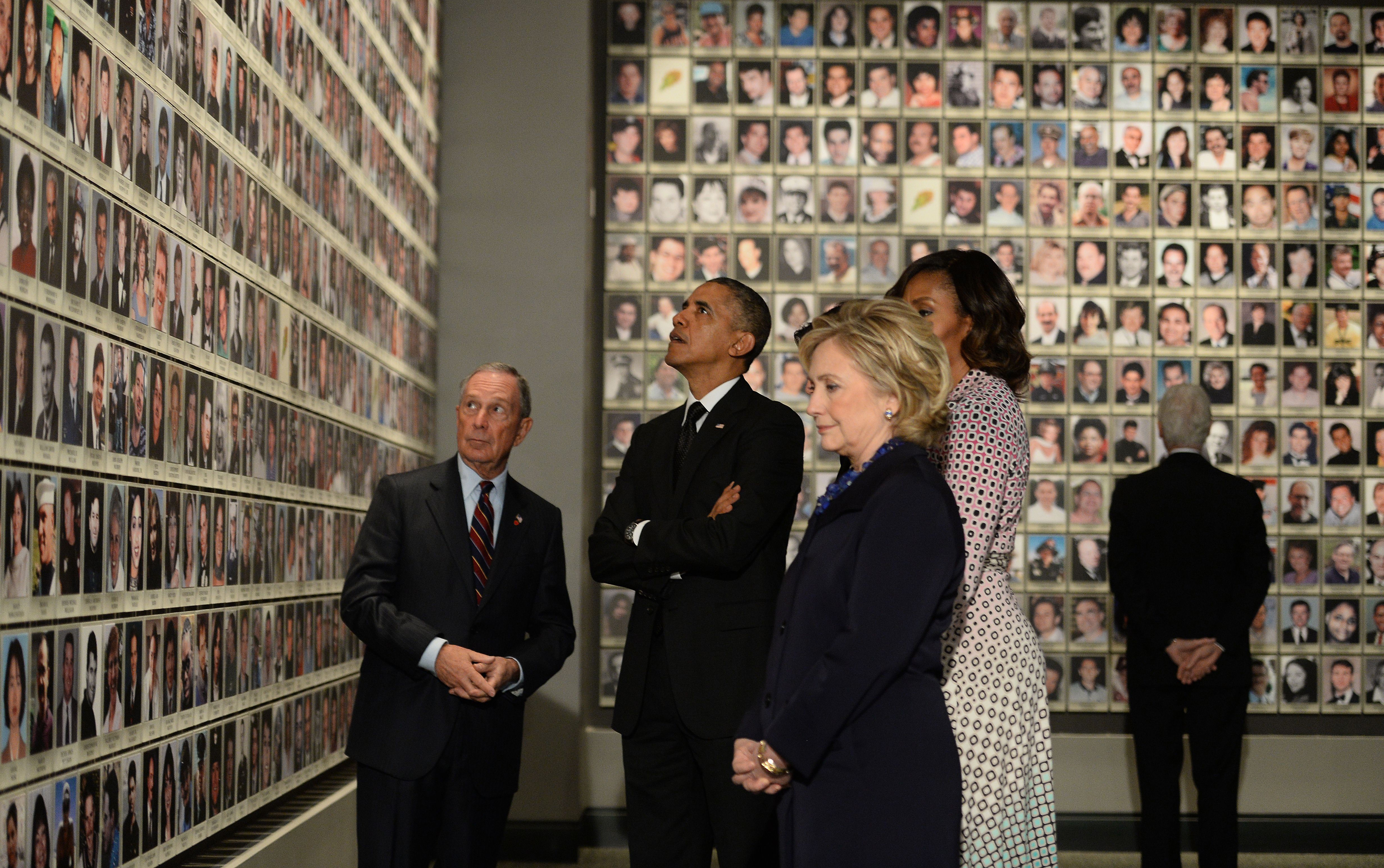 President Barack Obama, former New York Mayor Michael Bloomberg, First Lady Michelle Obama, former Secretary of State Hillary Clinton and former President Bill Clinton tour the National September 11 Memorial & Museum on May 15, 2014. (AFP PHOTO/Jewel Samad/Getty Images)