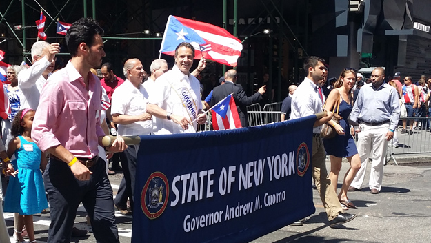 Gov. Andrew Cuomo marches in the National Puerto Rican Day Parade in Manhattan on June 8, 2014. (Credit: Ginny Kosola/WCBS 880)