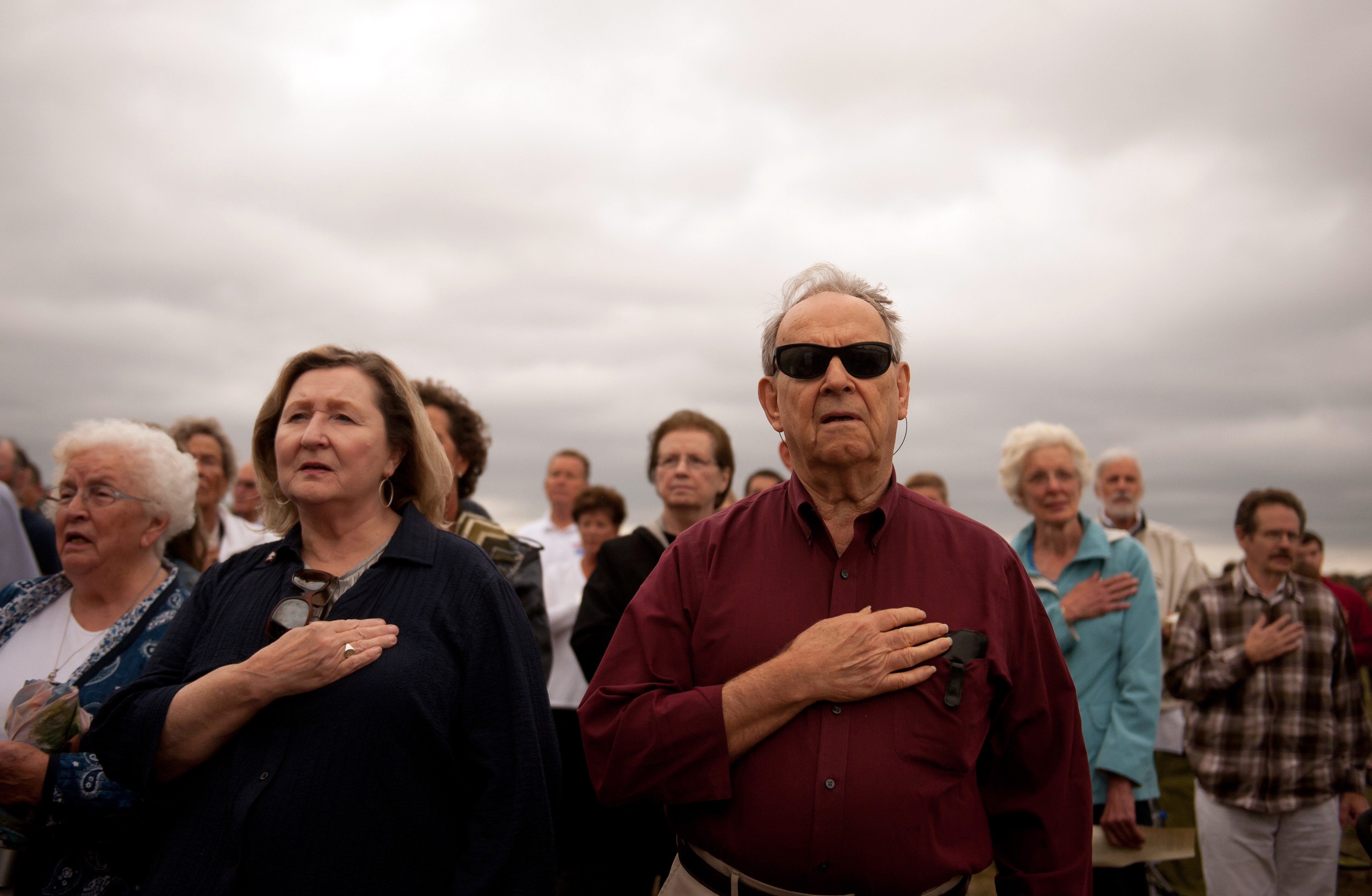 People gather during 13th anniversary ceremonies commemorating the September 11th attacks at the Wall of Names at the Flight 93 National Monument September 11, 2014 in Shanksville, Pennsylvania. (Photo by Jeff Swensen/Getty Images)