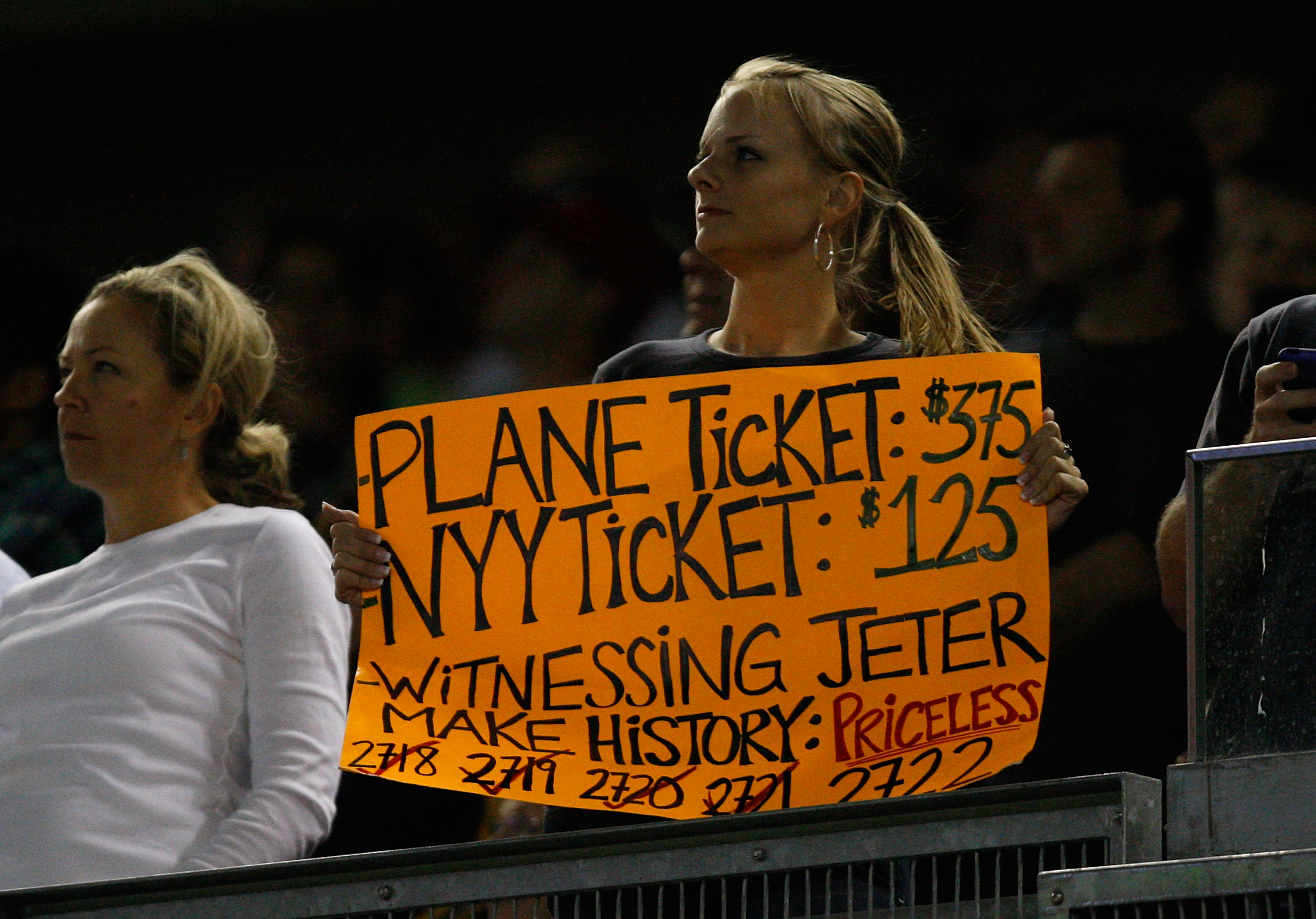A Yankees fan holds a sign on September 9, 2009, when Derek Jeter got his 2,721st base hit, tying Lou Gehrig's all-time club record. (Photo by Jared Wickerham/Getty Images)