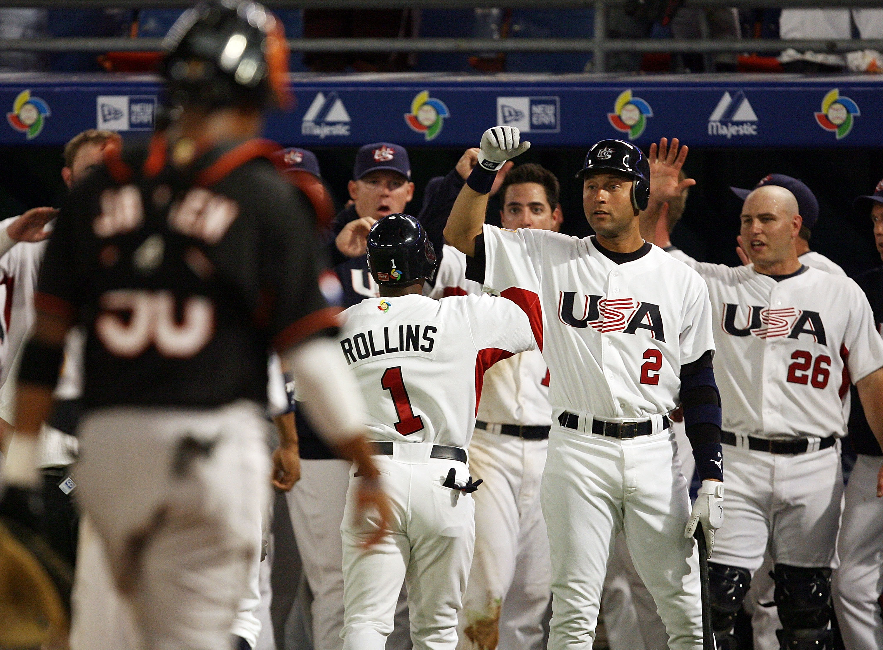 Jimmy Rollins is congratulated by Derek Jeter after hitting a two-run home run during the 2009 WBC.  (Photo by Doug Benc/Getty Images)