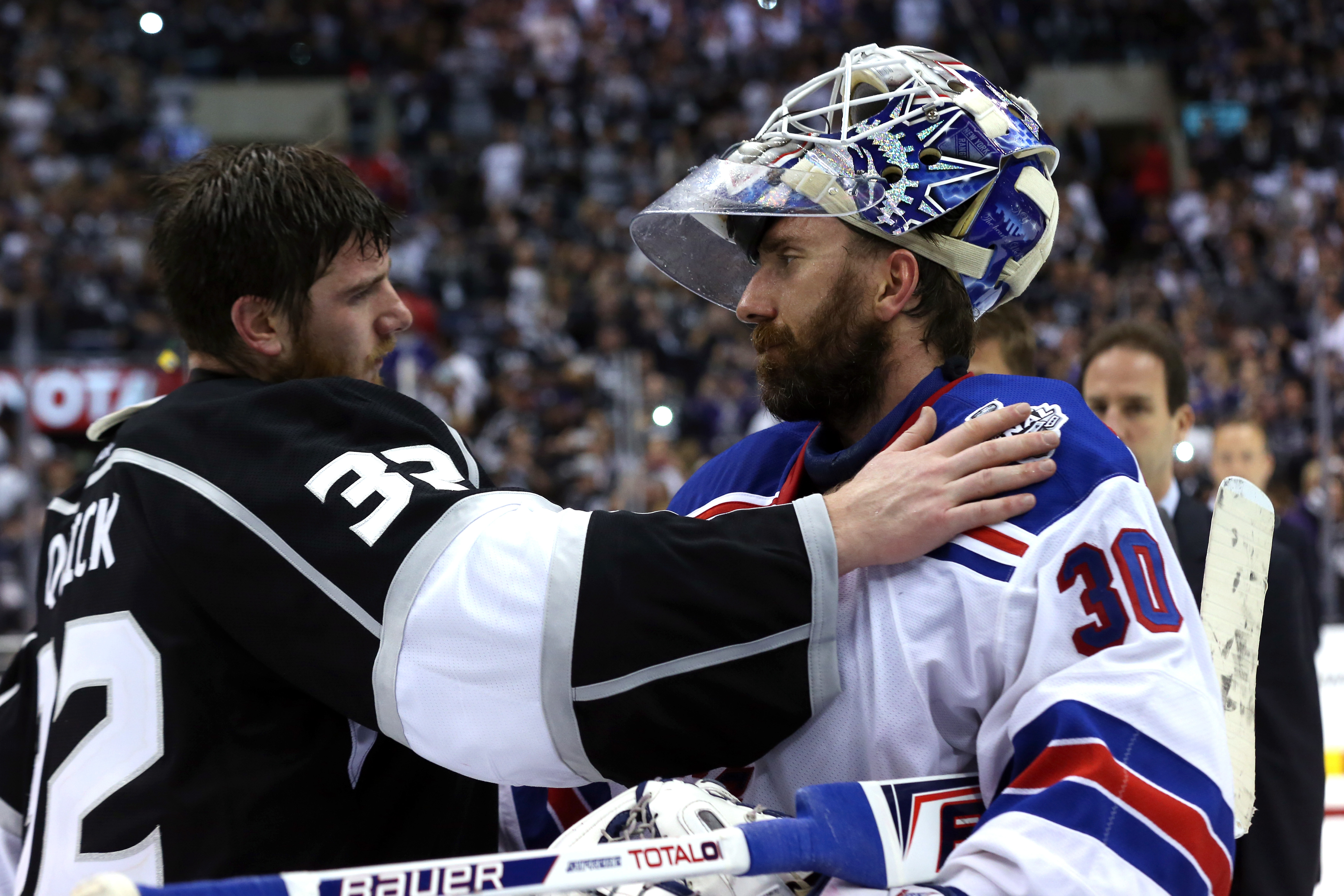 Jonathan Quick and Henrik Lundqvist shake hands after the Kings defeated the Rangers 3-2 in double overtime during Game 5 of the 2014 Stanley Cup Final at Staples Center on June 13, 2014 in Los Angeles, California.  (Photo by Bruce Bennett/Getty Images)
