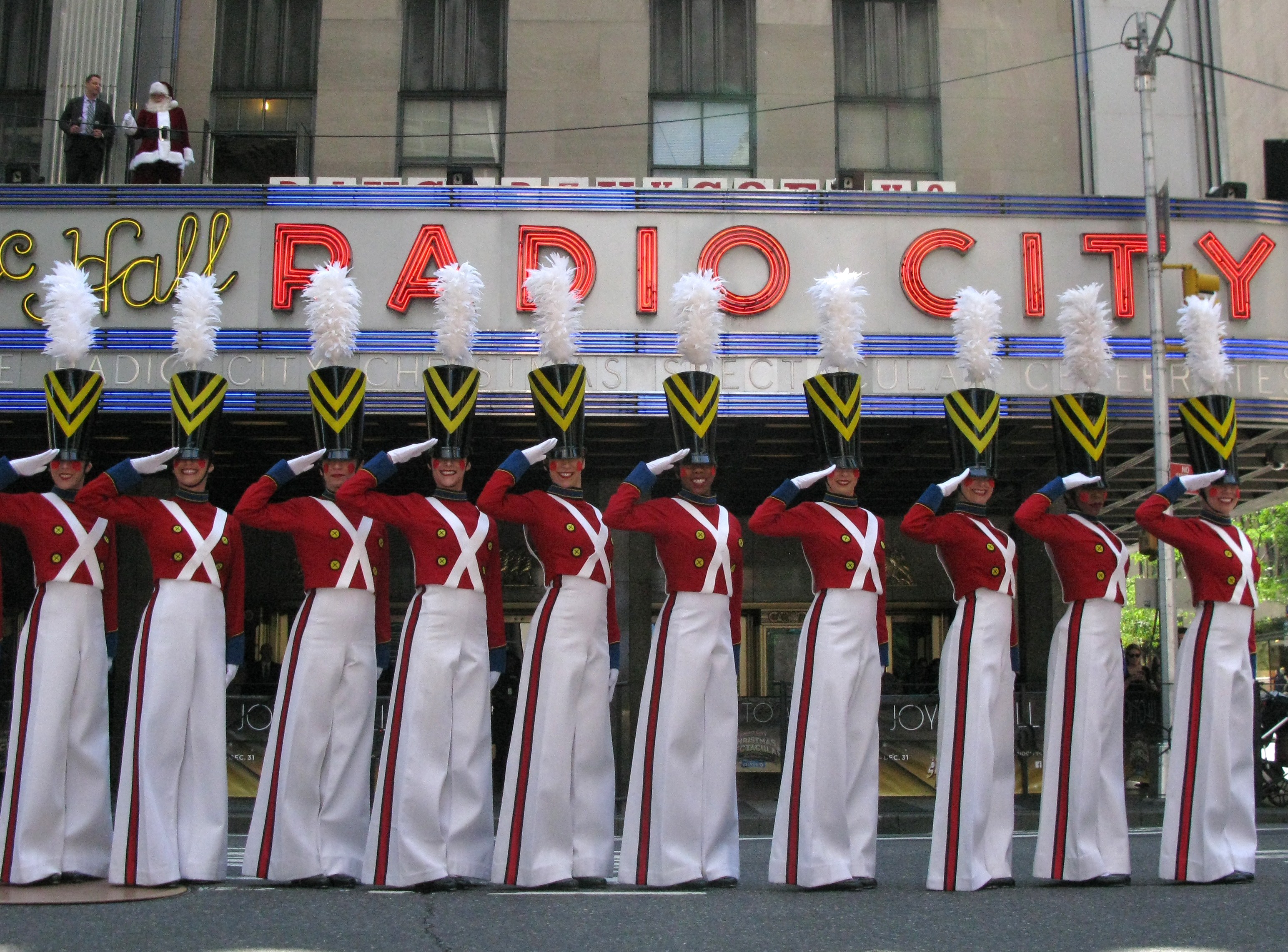 Santa Claus and the Radio City Rockettes perform on 6th Ave. August 14, 2014. (credit: AFP PHOTO/Don Emmert/Getty Images)