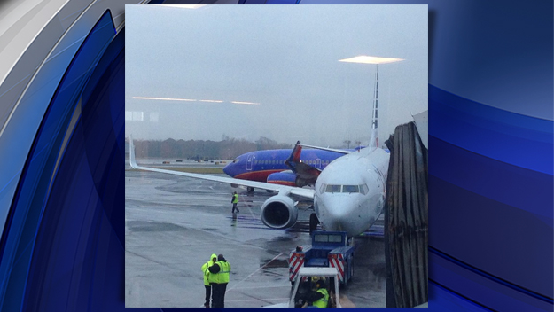 A Southwest Airlines jet and an American Airlines jet clipped wings at LaGuardia airport on Dec. 23, 2014. (credit: Jenny Kao) 