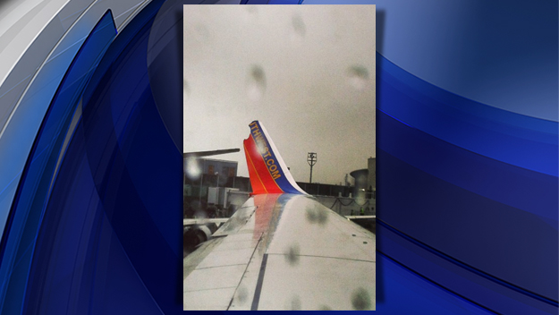 A Southwest Airlines jet and an American Airlines jet clipped wings at LaGuardia airport on Dec. 23, 2014. (credit: launaforehand via CBS2) 