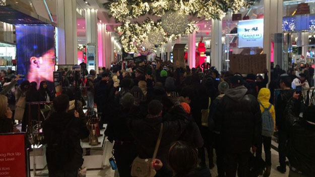 Protesters angry about the Eric Garner and Michael Brown grand jury decisions head to Macy's in Herald Square. (Credit: Matt Kozar/CBS2)