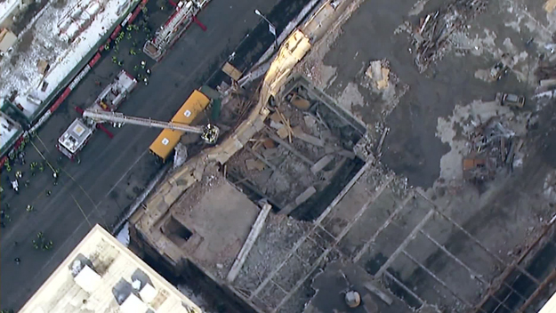 Emergency responders on the scene of a collapse on West 57th street on Feb. 25, 2015. (credit: CBS2) 