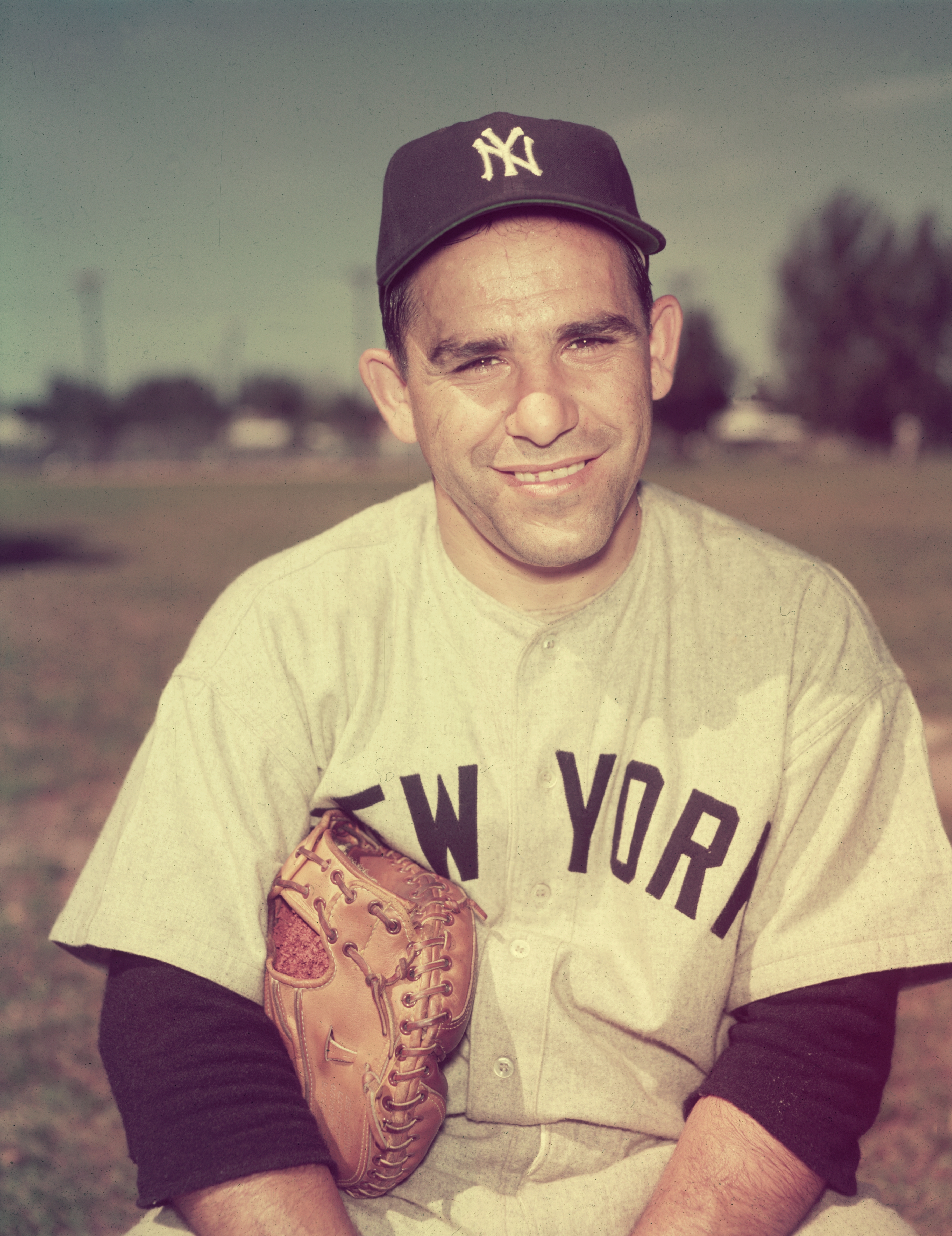 circa 1955: Portrait of Yogi Berra in his New York Yankees uniform with a baseball glove under his arm, New York City. (Photo by Hulton Archive/Getty Images)