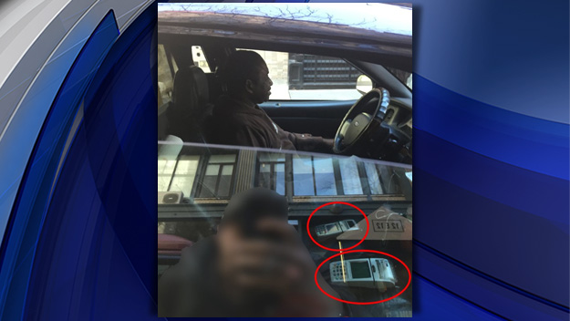 A man believes he was the victim of a credit card skimmer in this allegedly fake cab. (Credit: CBS2)