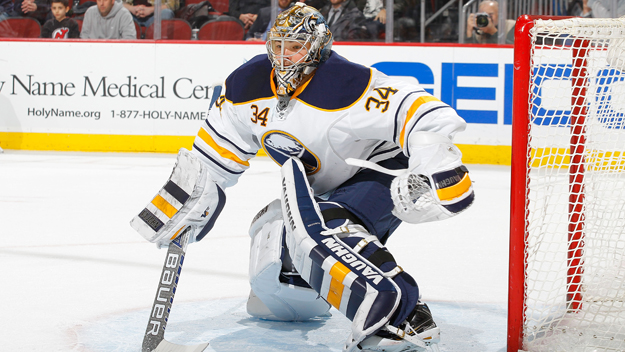Michal Neuvirth, then of the Buffalo Sabres, is seen here in action against the New Jersey Devils at the Prudential Center on Feb. 17, 2015. (Photo by Jim McIsaac/Getty Images)