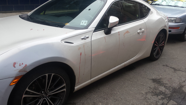 A car with blood on it outside 1 OAK nightclub on Wednesday, April 8, 2015. (Credit: Marla Diamond/WCBS 880)