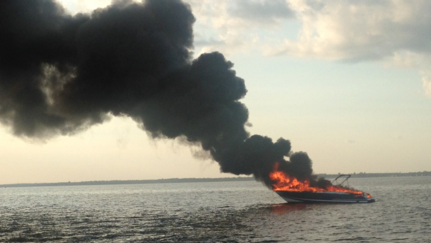 Authorities rescued three men from the water after their boat caught fire in Long Island's Great South Bay on June 6, 2015. (Credit: Suffolk County Police Department)