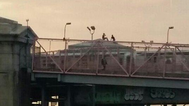 At least two people were seen climbing on the Williamsburg Bridge on Wednesday, July 15. (Credit: NYCityAlerts)