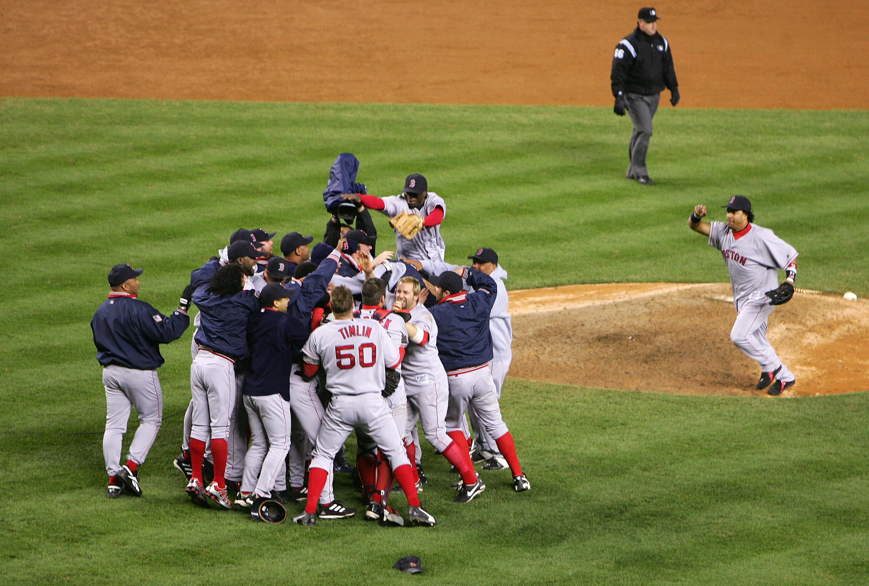 NEW YORK - OCTOBER 20: The Boston Red Sox celebrate after defeating the New York Yankees 10-3 to win game seven of the American League Championship Series on October 20, 2004 at Yankee Stadium in the Bronx borough of New York City. (Photo by Ezra Shaw/Getty Images)