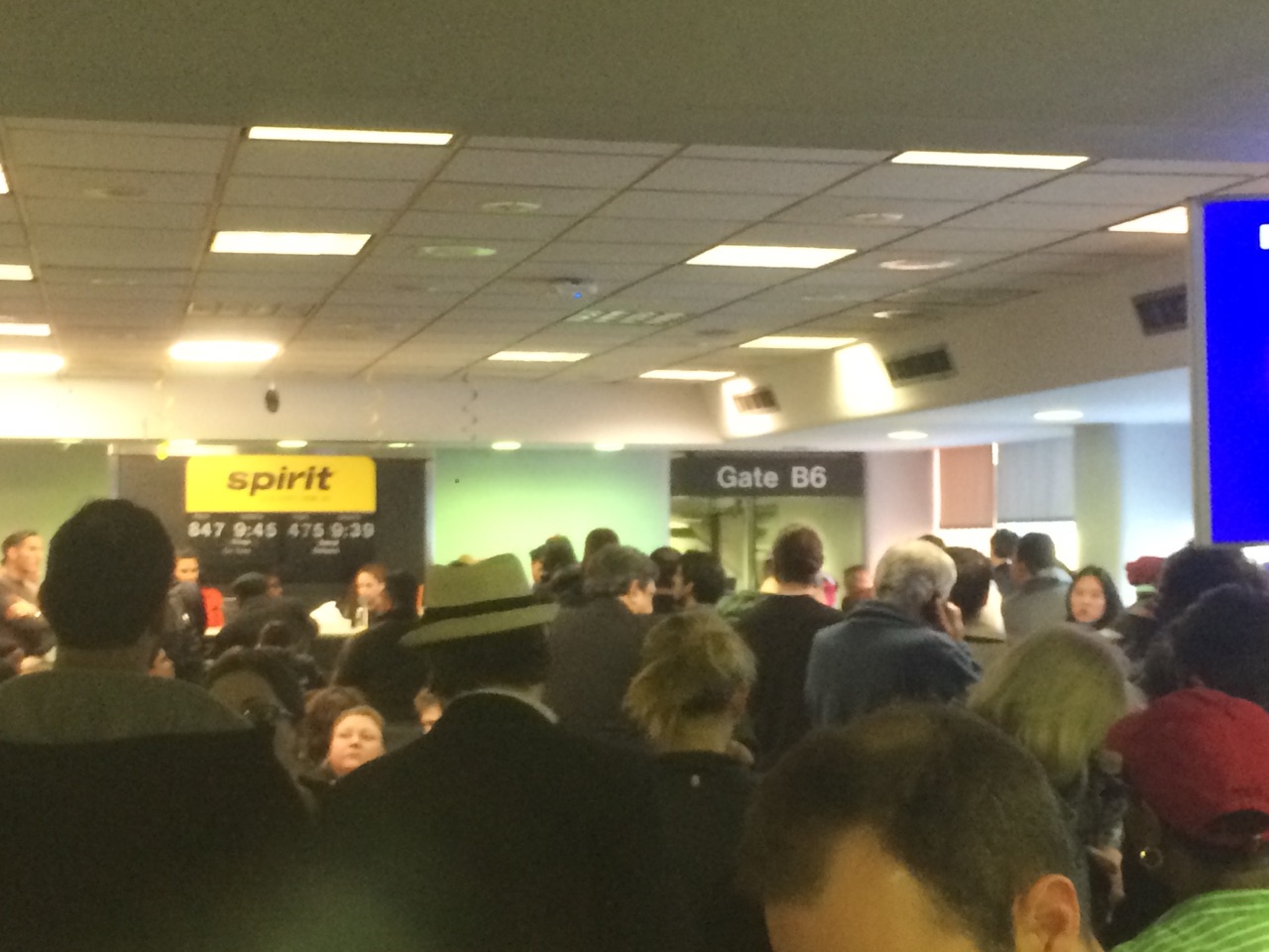 A crowded gate at LaGuardia Airport after passengers were evacuated from a Spirit Airlines flight on Dec. 26, 2015 (credit: Zach Staggers)
