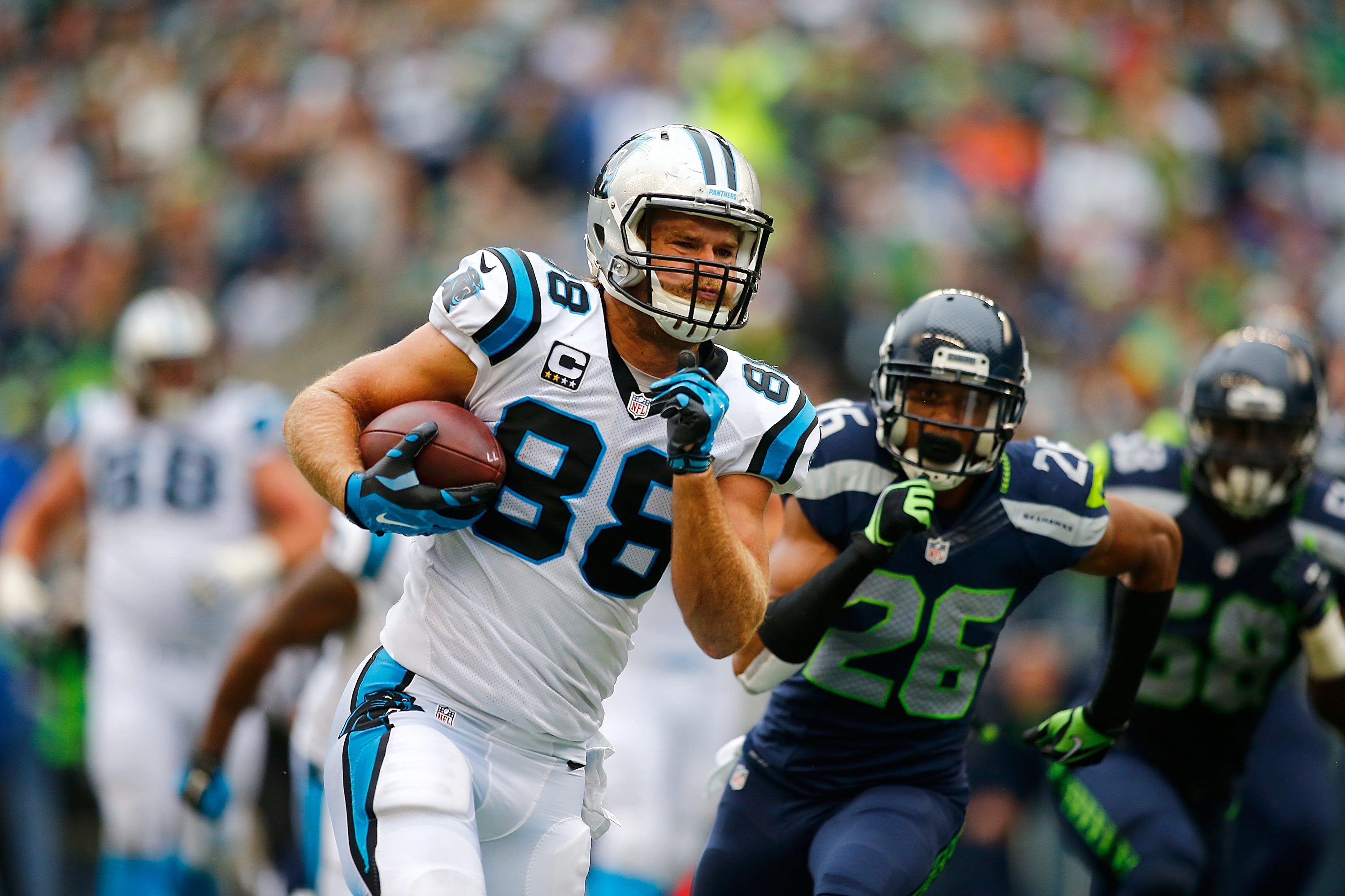 Panthers tight end Greg Olsen runs with the ball against the Seahawks at CenturyLink Field in Seattle on Oct. 18, 2015. (Photo by Jonathan Ferrey/Getty Images)