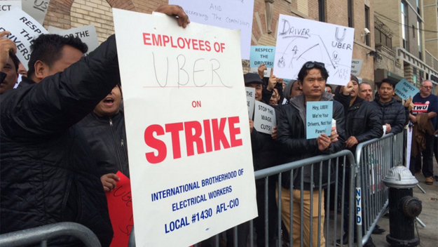 Uber drivers upset of fare cuts protest outside the company's Queens office on Feb. 1, 2016. (Credit: Sonia Rincon/1010 WINS)