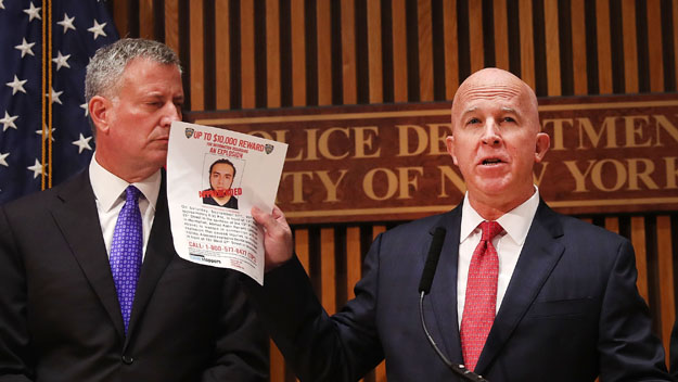 New York City police commissioner James O'Neill holds up a picture of Ahmad Khan Rahami, the man believed to be responsible for the explosion in Manhattan on Saturday night and an earlier bombing in New Jersey, at a news conference at New York City on September 19, 2016 in New York City. Rahami was taken into custody on Monday afternoon following a gunfight where he was wounded by he police.  (Photo by Spencer Platt/Getty Images)
