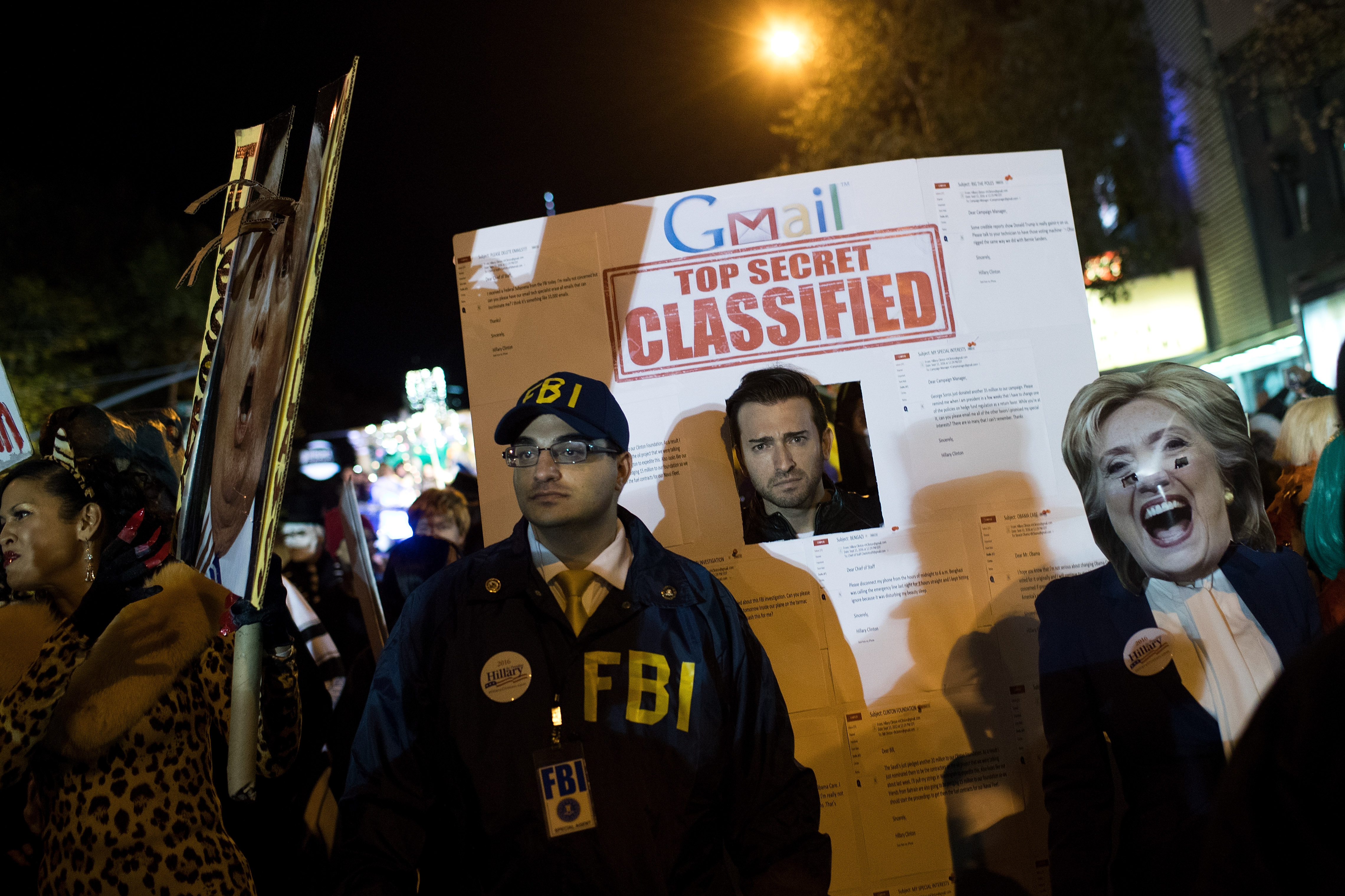 A group dressed as 'Hillary Clinton's emails' walk along Sixth Avenue during the 43rd annual Village Halloween Parade, October 31, 2016 in New York City. Thousands of people are expected to attend as the parade travels up Sixth Avenue through the West Village. (Photo by Drew Angerer/Getty Images)