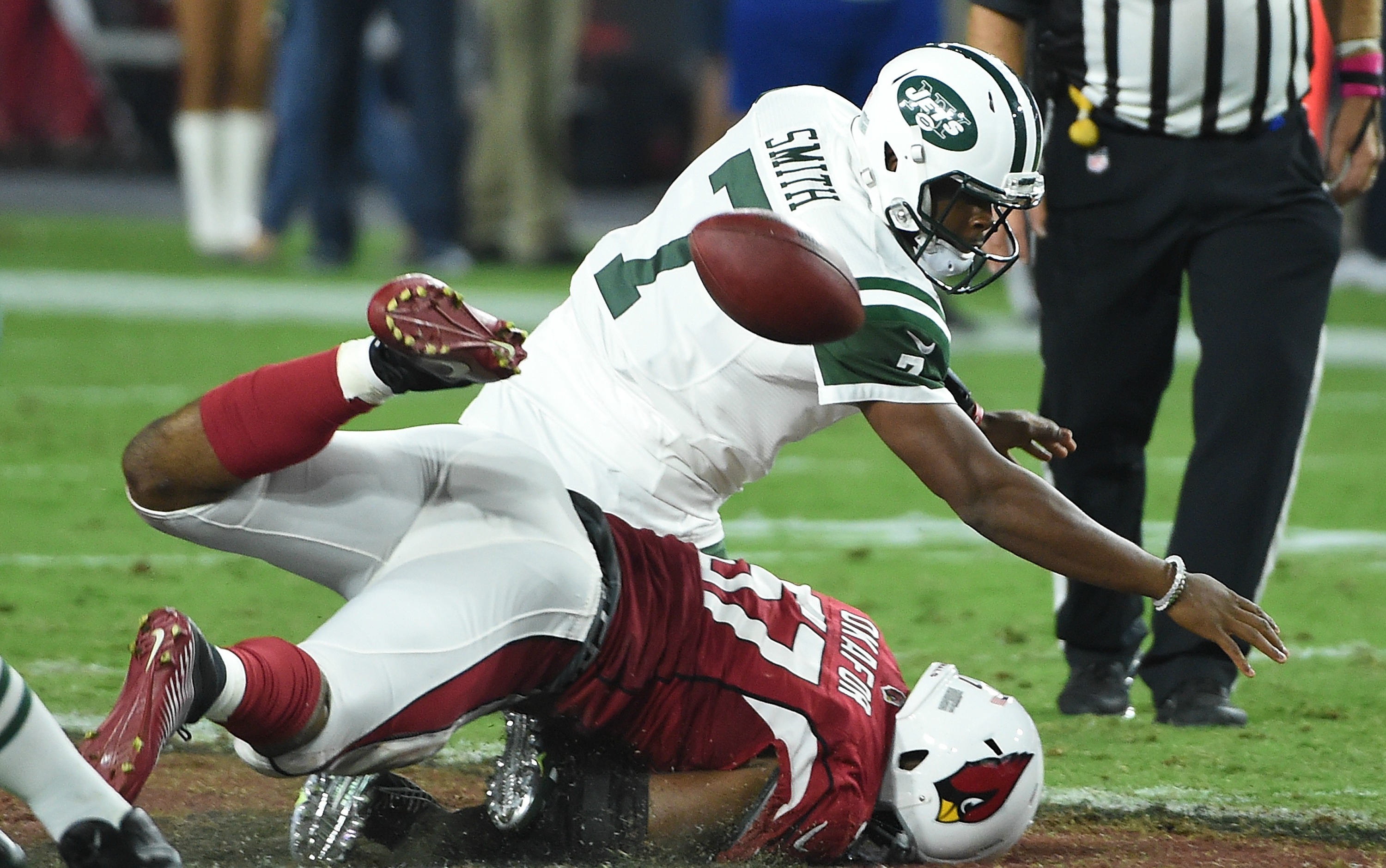 Geno Smith gets sacked against the Cardinals