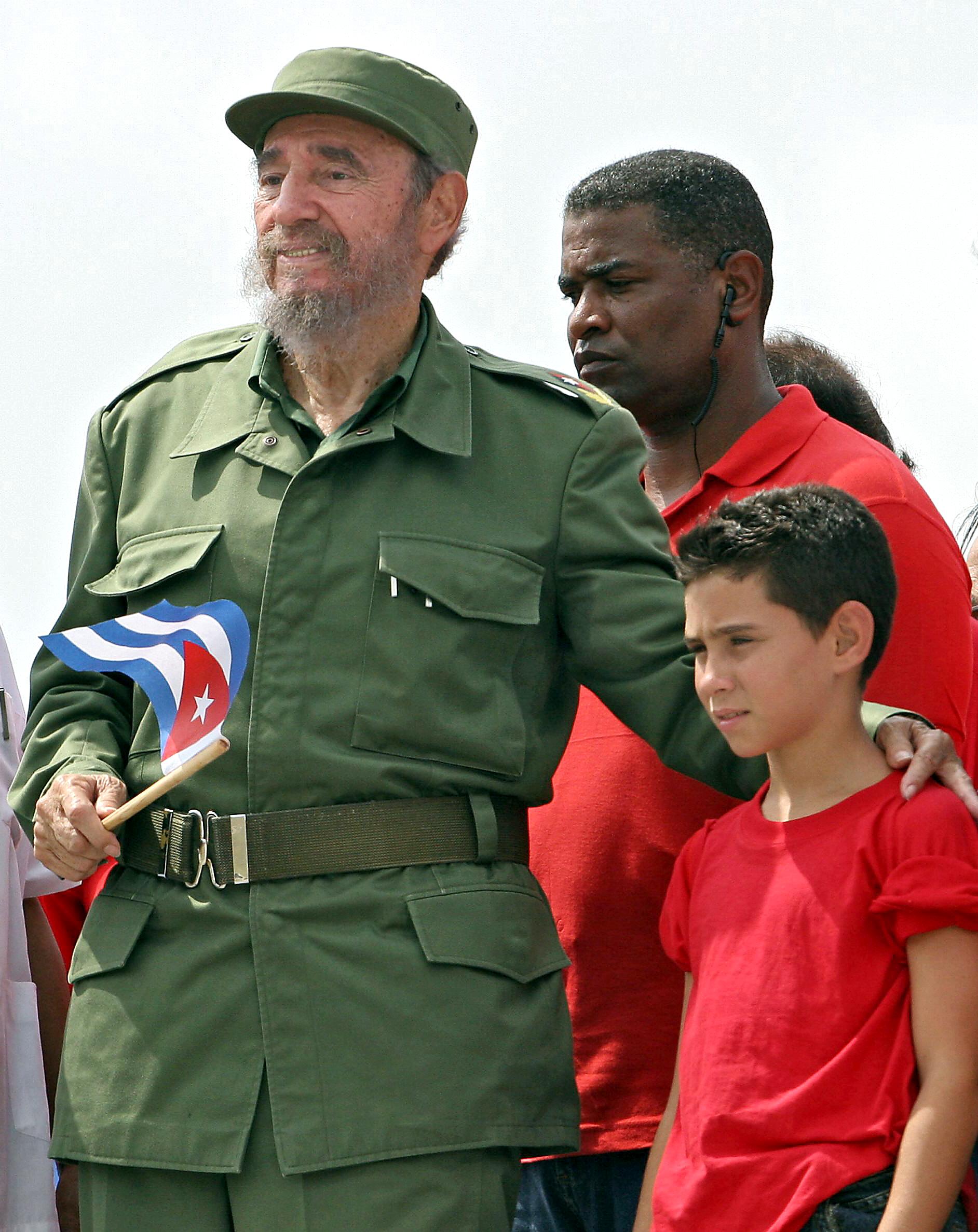 Cuban President Fidel Castro poses with shipwreck survivor Elian Gonzalez, after presiding over a massive May Day demonstration at Havana's Plaza de la Revolucion in May 2005. (ADALBERTO ROQUE/AFP/Getty Images)